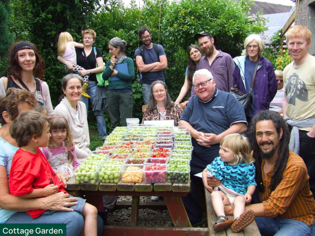 Graham Bell at Cottage Garden open day with people sharing produce